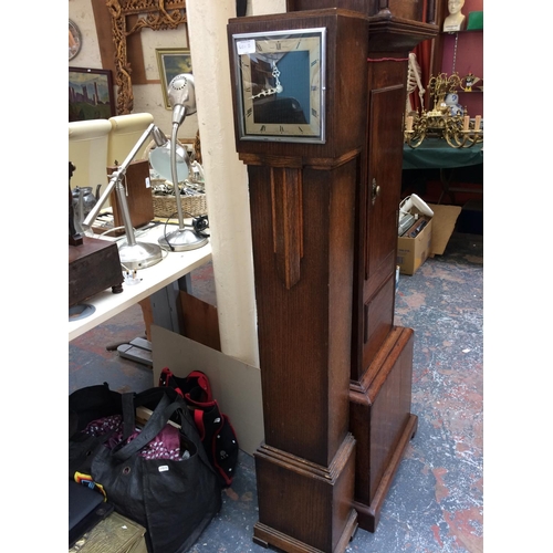 401B - A VINTAGE ART DECO SMITH'S OAK CASED ELECTRIC GRANDDAUGHTER CLOCK