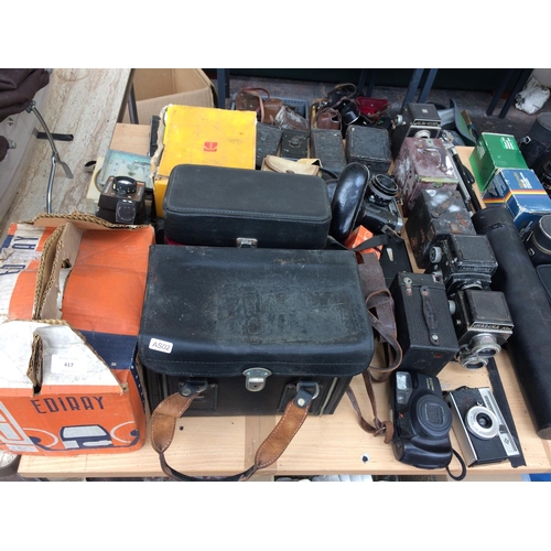 417 - A LARGE COLLECTION OF VINTAGE CAMERAS AND EQUIPMENT