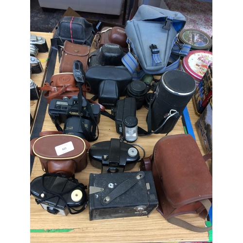 422 - A COLLECTION OF CASED CAMERAS AND LENSES TO INCLUDE BROWNIE CAMERA, OPERA BINOCULARS ETC