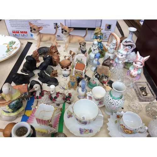 446 - A LARGE COLLECTION OF MINIATURE ORNAMENTS AND CUPS AND SAUCERS TO INCLUDE DOGS, DUCKS, CATS, BIRDS E... 