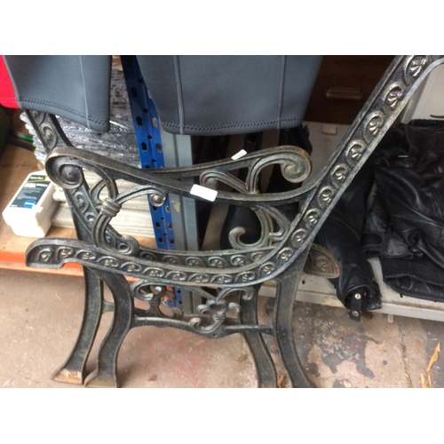 45 - A PAIR OF BLACK PAINTED CAST IRON ORNATE GARDEN BENCH ENDS