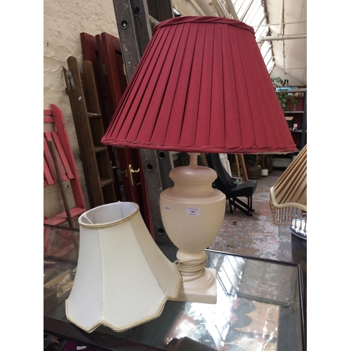 464 - A CERAMIC TABLE LAMP WITH BURGUNDY SHADE