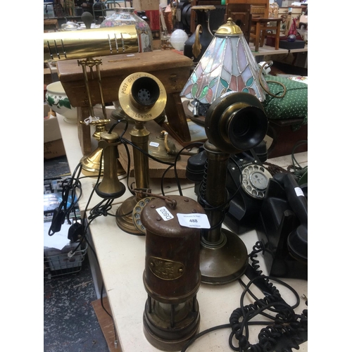 488 - THREE ITEMS TO INCLUDE TWO BRASS CANDLESTICK TELEPHONES AND A VINTAGE BRASS MINERS LAMP