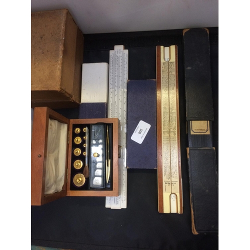 500 - THREE ITEMS TO INCLUDE A CASED SET OF SCALE WEIGHTS AND TWO BOXED UNIVERSAL SLIDE RULES