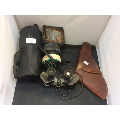 503 - THREE ITEMS TO INCLUDE A CASED VINTAGE GAS MASK, A PAIR OF MILITARY BINOCULARS AND A BROWN LEATHER G... 