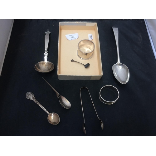 524 - A BOX CONTAINING SILVER WARE TO INCLUDE HALLMARKED SILVER NAPKIN RINGS, LARGE HALLMARKED SILVER SPOO... 