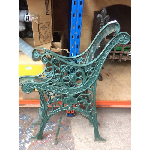 56 - A PAIR OF GREEN PAINTED CAST IRON ORNATE GARDEN BENCH ENDS