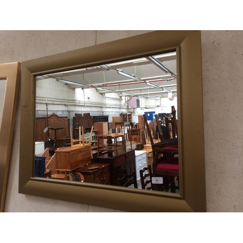 566 - MODERN GOLD FRAMED WALL MIRROR