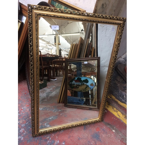 573 - A GILT FRAMED MIRROR