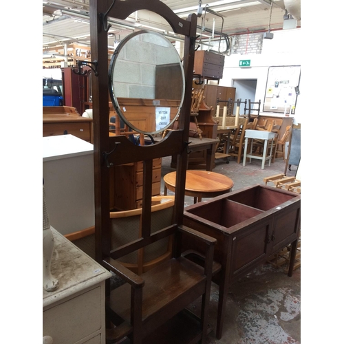 599 - A VINTAGE OAK HALL STAND WITH CENTRE MIRROR