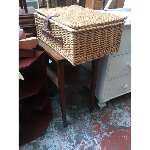 601 - A SMALL OAK OCCASIONAL TABLE AND A WICKER PICNIC BASKET