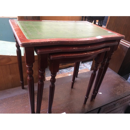 604 - A MAHOGANY NEST OF THREE TABLES