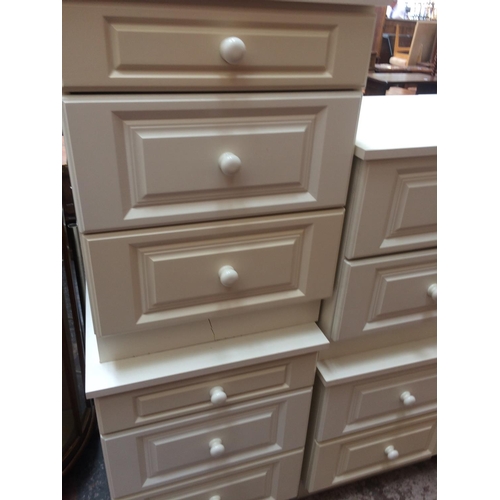 610 - TWO MODERN WHITE BEDSIDE CHESTS OF THREE DRAWERS