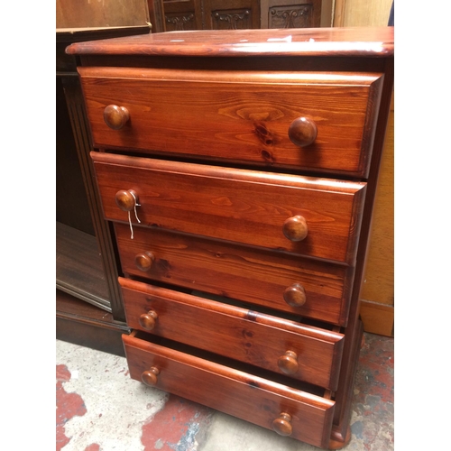 613 - A MODERN STAINED PINE CHEST OF FIVE DRAWERS