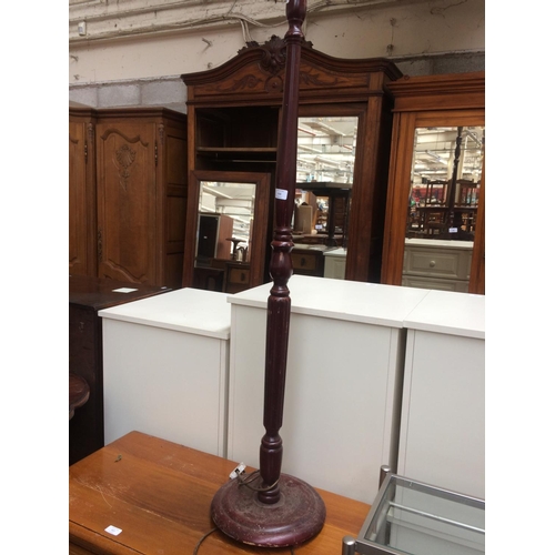 616 - A MAHOGANY STANDARD LAMP WITH CREAM SHADE