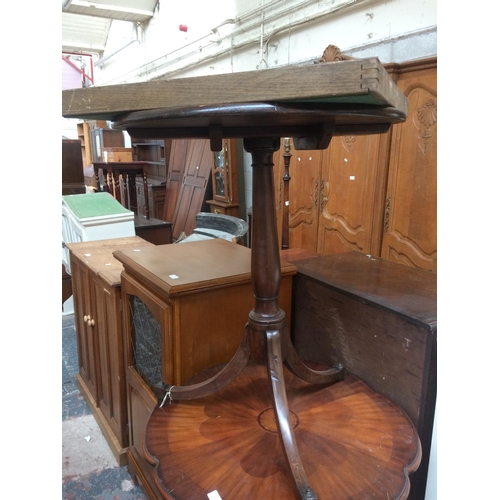 618 - AN ANTIQUE MAHOGANY ROUND TABLE ON TRIPOD SUPPORT WITH ORNATE CARVING AND A COLLAPSIBLE CARD TABLE