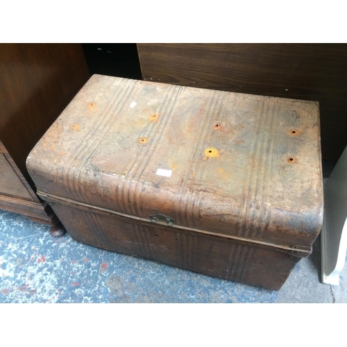 623 - A VINTAGE TIN TRAVELLING TRUNK