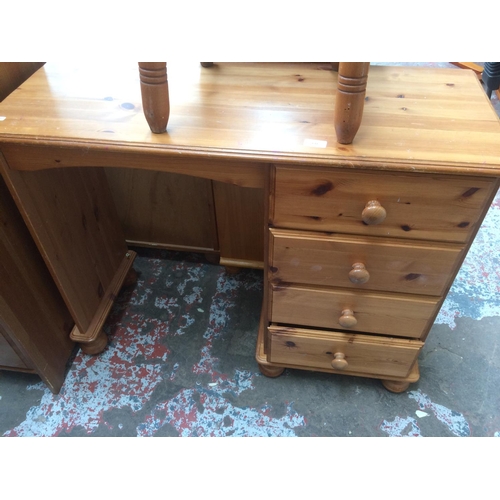 632 - A MODERN PINE DRESSING TABLE WITH FOUR DRAWERS