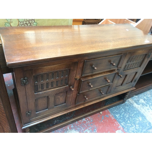 649 - A GOOD QUALITY OAK SIDEBOARD WITH TWO DOORS AND THREE DRAWERS ON STRETCHER BASE (MEASURING 50