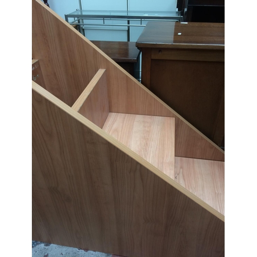 653 - AN OAK EFFECT STAIR STORAGE CABINET