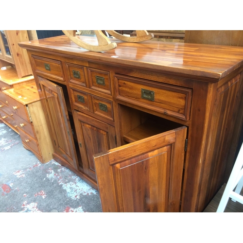 661 - A GOOD QUALITY LARGE INDIAN HARDWOOD/ SHEESHAM WOOD SIDEBOARD WITH THREE DOORS, TWO LONG DRAWERS, TW... 