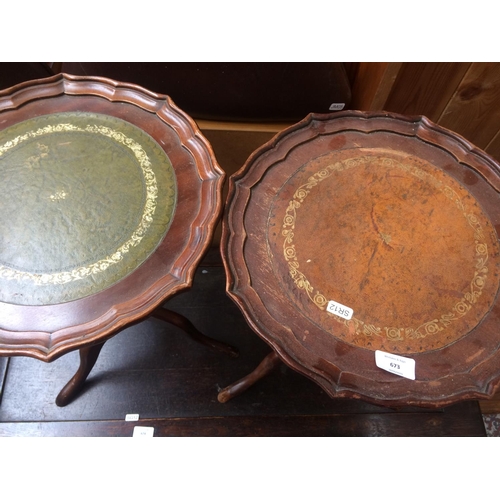 673 - TWO MAHOGANY WINE TABLES WITH LEATHER INSERTS