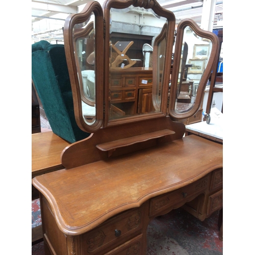 678 - A GOOD QUALITY FRENCH OAK DRESSING TABLE WITH UPPER THREE SECTION BEVEL EDGE MIRROR AND FIVE LOWER D... 