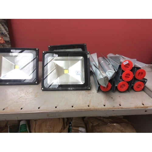 68 - ELEVEN ITEMS TO INCLUDE THREE LARGE LED FLOOD LIGHTS AND EIGHT ROTARY CLOTHES DRYER FLOOR BRACKETS