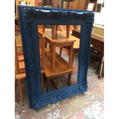 688 - A LARGE ORNATE BLUE PAINTED FRAME