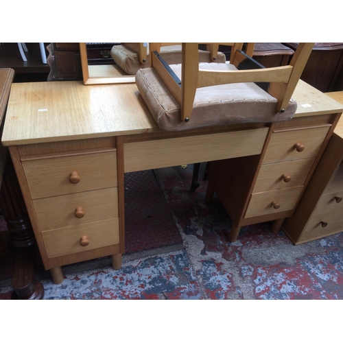 697 - A RETRO TEAK DRESSING TABLE WITH SIX DRAWERS, UPPER MIRROR AND STOOL