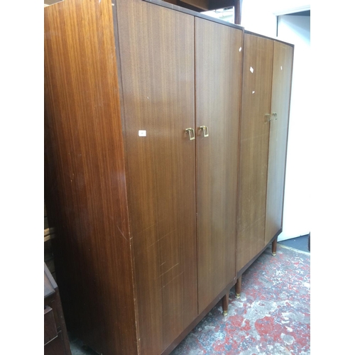 707 - WITHDRAWN  - A MID-CENTURY G-PLAN MAHOGANY BEDROOM SUITE COMPRISING OF TWO DOUBLE DOOR WARDROBES AND... 