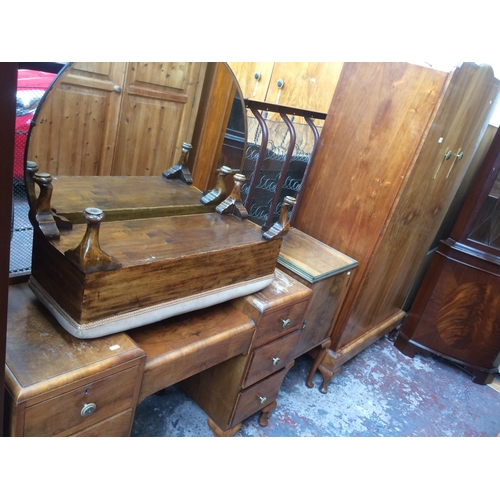 716 - AN ART DECO BURR WALNUT BEDROOM SUITE COMPRISING OF TWO DOUBLE DOOR WARDROBES, DRESSING TABLE, BEDSI... 