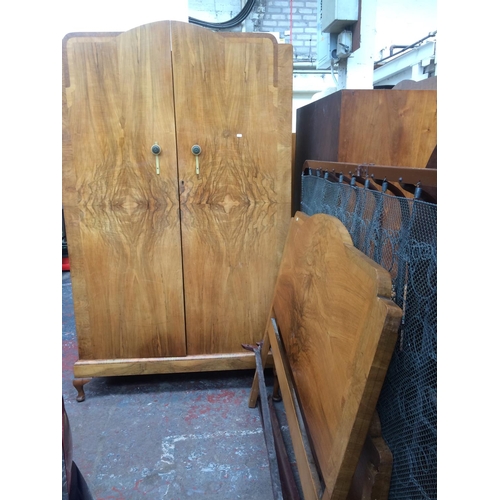 716 - AN ART DECO BURR WALNUT BEDROOM SUITE COMPRISING OF TWO DOUBLE DOOR WARDROBES, DRESSING TABLE, BEDSI... 