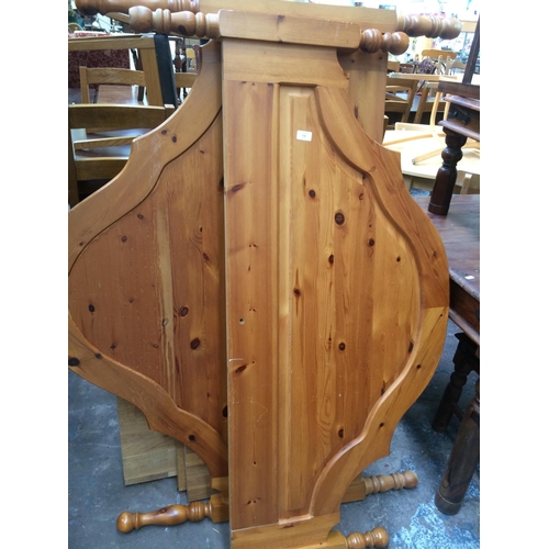 732 - A PINE DOUBLE BED FRAME WITH HEADBOARD AND SLATS