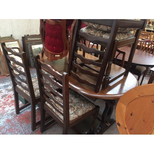 733 - AN OAK DINING TABLE AND FOUR MATCHING LADDER BACK DINING CHAIRS