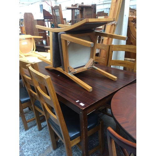 736 - A MODERN MAHOGANY DINING TABLE WITH SIX LADDER BACK DINING CHAIRS AND TWO OTHER CHAIRS