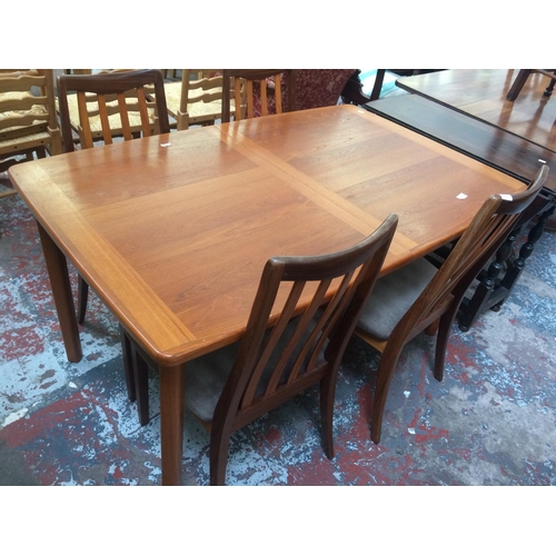 756 - A 1970'S EXTENDING TEAK DINING TABLE TOGETHER WITH A SET OF FOUR G-PLAN FRESCO HIGH BACKED DINING CH... 