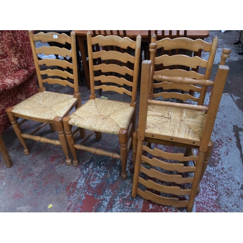 757 - A SET OF FOUR MODERN BEECH FRAMED LADDER BACKED FARMHOUSE DINING CHAIRS WITH RUSH SEAT