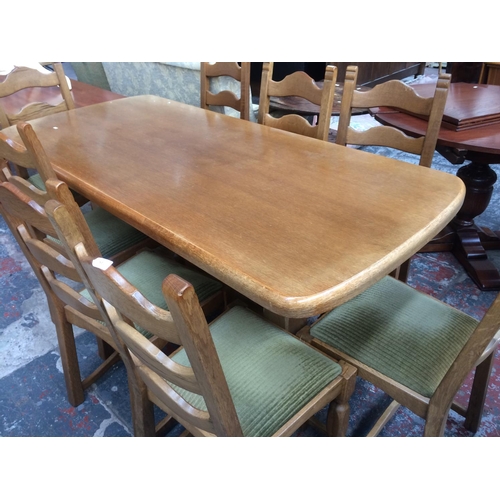 761 - A GOOD QUALITY ENGLISH OAK REFECTORY DINING TABLE ON CARVED BALUSTER SUPPORTS TOGETHER WITH EIGHT MA... 