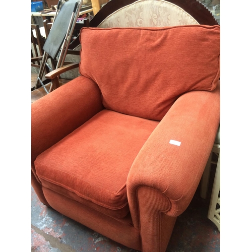 775 - AN ORANGE UPHOLSTERED OCCASIONAL CHAIR