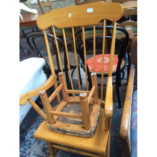 785 - A MODERN BEECH SPINDLE BACK ROCKING CHAIR AND A STOOL