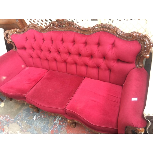 787 - A GOOD QUALITY VICTORIAN STYLE MAHOGANY FRAMED THREE SEATER SOFA WITH RED BUTTON BACK UPHOLSTERY