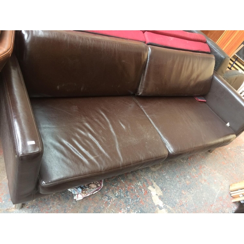 796 - A BROWN LEATHER TWO SEATER SOFA