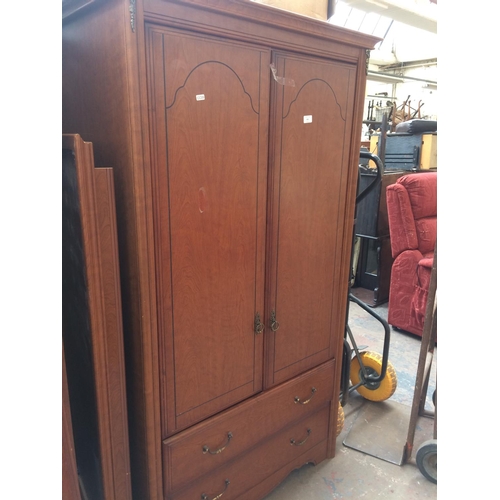 811 - A MAHOGANY EFFECT BEDROOM SUITE COMPRISING OF A SMALL DOUBLE DOOR WARDROBE, LARGE DOUBLE DOOR WARDRO... 