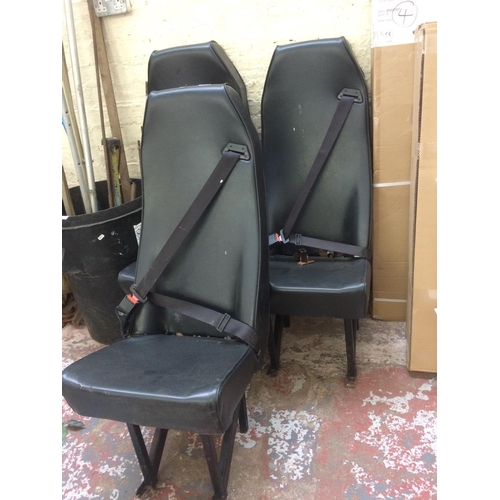 84 - THREE BLACK VINYL VAN OR MINIBUS SEATS WITH BELTS