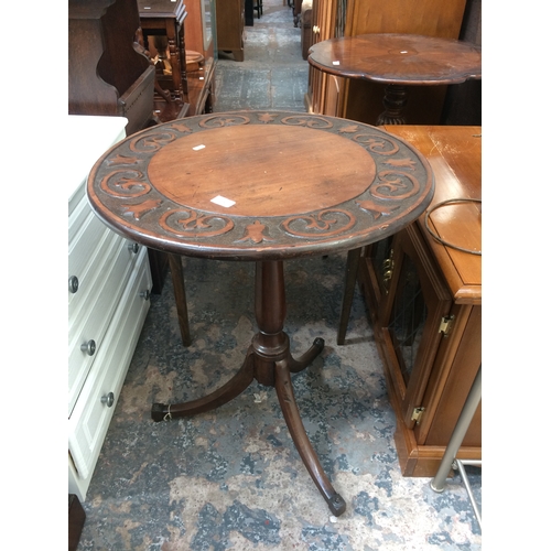 618 - AN ANTIQUE MAHOGANY ROUND TABLE ON TRIPOD SUPPORT WITH ORNATE CARVING AND A COLLAPSIBLE CARD TABLE