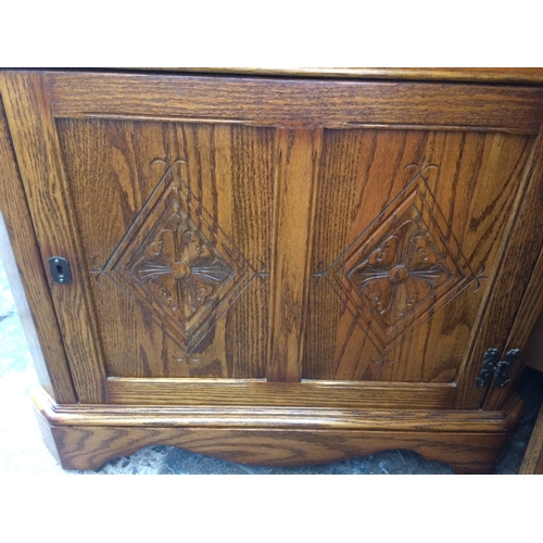 638 - A GOOD QUALITY JAYCEE OAK FREE STANDING CORNER CABINET WITH ONE UPPER LEADED GLASS DOOR, ONE LOWER D... 