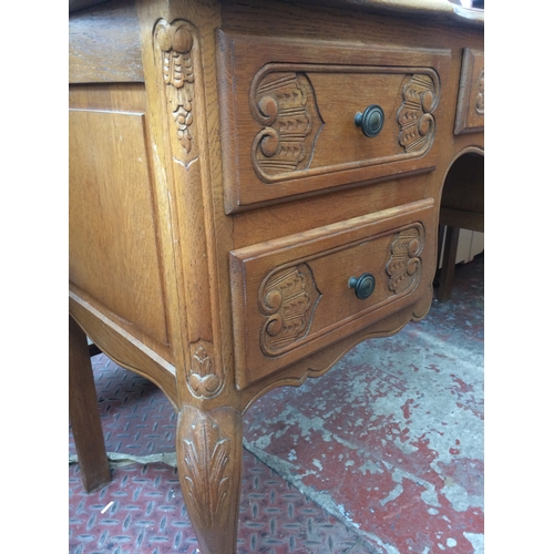 678 - A GOOD QUALITY FRENCH OAK DRESSING TABLE WITH UPPER THREE SECTION BEVEL EDGE MIRROR AND FIVE LOWER D... 