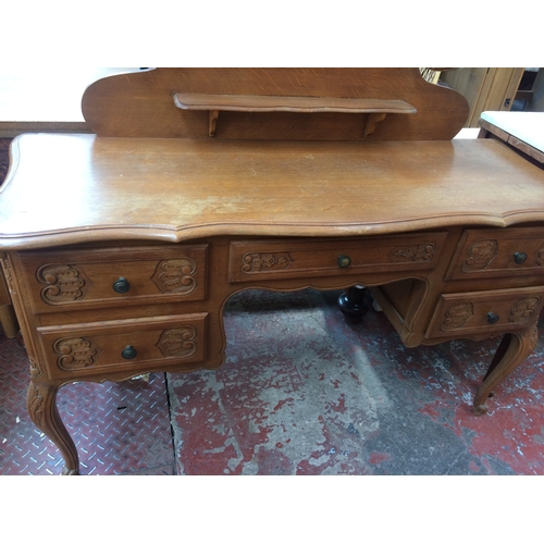 678 - A GOOD QUALITY FRENCH OAK DRESSING TABLE WITH UPPER THREE SECTION BEVEL EDGE MIRROR AND FIVE LOWER D... 