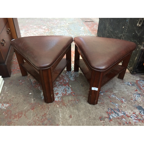 703 - A PAIR OF BROWN LEATHERETTE TRIANGULAR FOOTSTOOLS